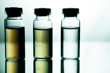 Group object of liquid medicinal agent in limpid glassware in medical laboratory. Group of ampoules with a transparent medicine in medical laboratory