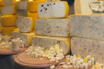 Variety of cheese on the store counter. Food