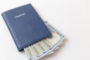 Passport and dollar bills on isolated white background. The concept of travel and business