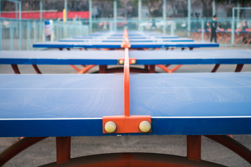 Fototapeta na wymiar Ping-pong Tables Standing in Row in Xi'an University of Technology Qu Jiang Campus, China 2018