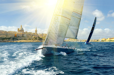 Sailing yachts and sun rays. Sailing. Yachting