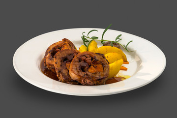 stuffed chicken fillet with roasted vegetables garnished with gravy sauce