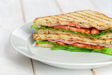 Club sandwich on wooden table