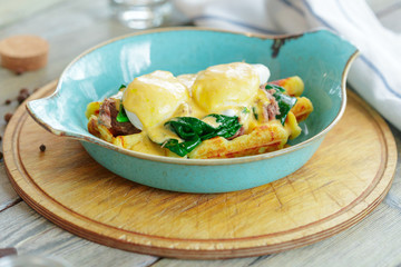 Savory belgian waffles with salad and poached egg