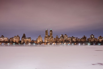 New York City Central Park reservoir and West Side midtown Manhattan skyline in the winter