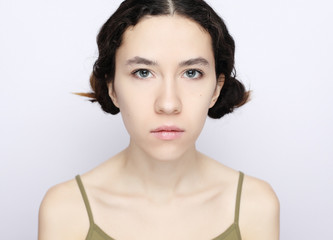 Naklejka premium young brunette model on a white background