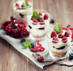 Natural yogurt with fresh berries and muesli. Healthy dessert.