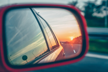 Sunset reflection in the rear view mirror