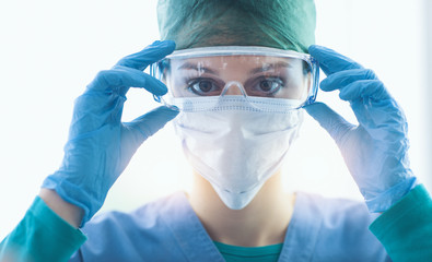 Surgeon wearing protective glasses