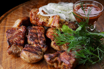 Pork shish kebab with herb sauce and onion