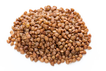 Buckwheat grains isolated on the white background.