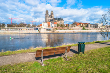 View of Magdeburg Cathedral and Elbe river from a bench, Magdeburg, Germany