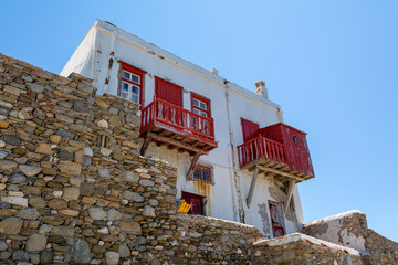 Greek house with red balcony in Mykonos town. Greece