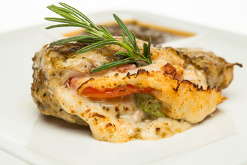 Chicken breast with cheese and rosemary herb closeup