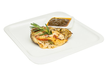 Roasted chicken breast with cheese and rosemary herb on white plate isolated