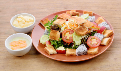 vegetable salad isolated on wooden background