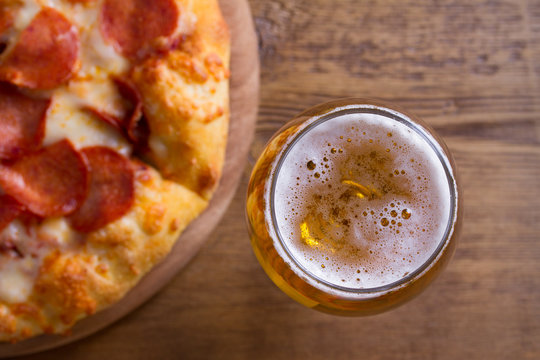 Beer And Pizza. Glass Of Beer. Ale And Appetizer Snack. View From Above, Top