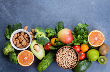 Healthy Food Clean Concept. Raw fruits, Vegetables, Nuts, Cereals on Concrete Stone Table Background.
