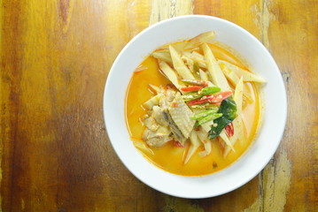 spicy boiled chicken with bamboo shoot in coconut milk curry on bowl