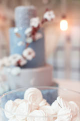 cakes in a vase on the buffet.