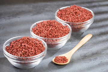 Annatto seeds in the bowls - bixa orellana