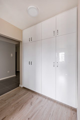 Hallway with white wardrobe