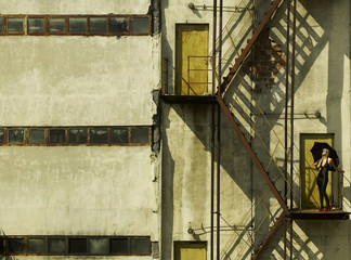 Fototapeta premium Young woman on a back street