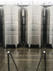 Wine fermentation tanks. New modern wine fermentation tanks in the factory courtyard.