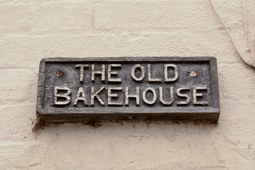 The Old Bakehouse sign on wall