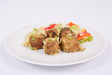 Thai tempeh with coriander and rice on a white