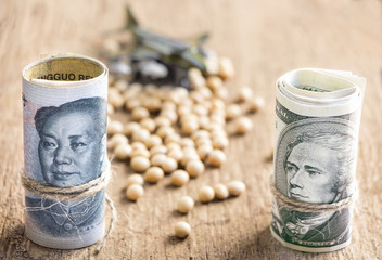 US dollar versus china yuan banknote on the wooden table background. The concept of business...
