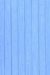 Obraz premium Wooden vertical planks painted in blue background