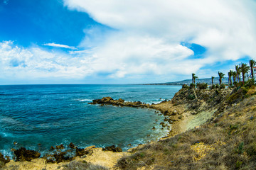 sea surface and sunny summer rocky coastline