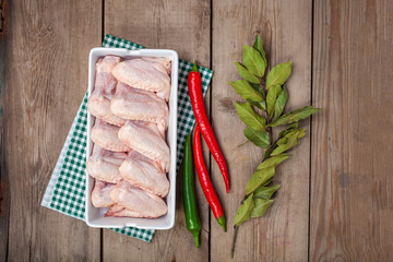 Chicken wings and spices. Selective focus. Top view. Copy space