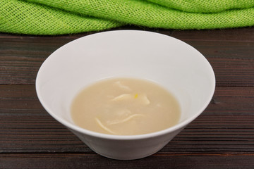Cauliflower soup with noodles on a table