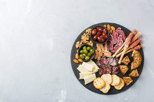 Assortment Of Spanish Tapas Or Italian Antipasti With Meat