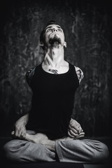 guy practices yoga postures
