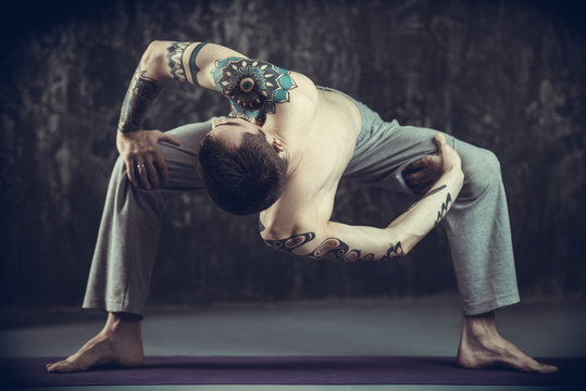 master practicing yoga