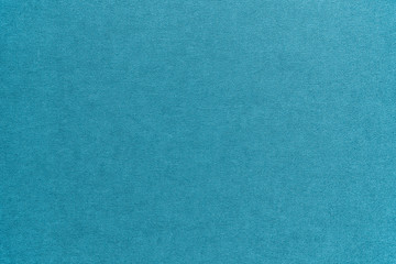 Textured light turquoise artistic grainy background for use in screensavers, wallpapers, for inscriptions and drawings
