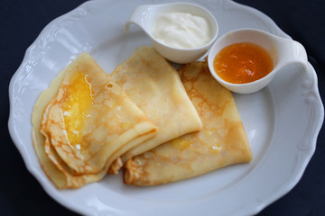 Photo of macro delicious Russian pancakes with honey