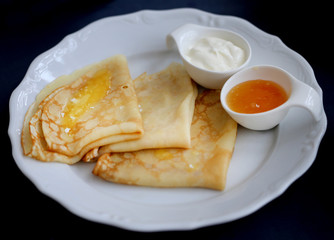 Photo of macro delicious Russian pancakes with honey