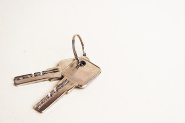 Keys on a light background. Candid, copy space.