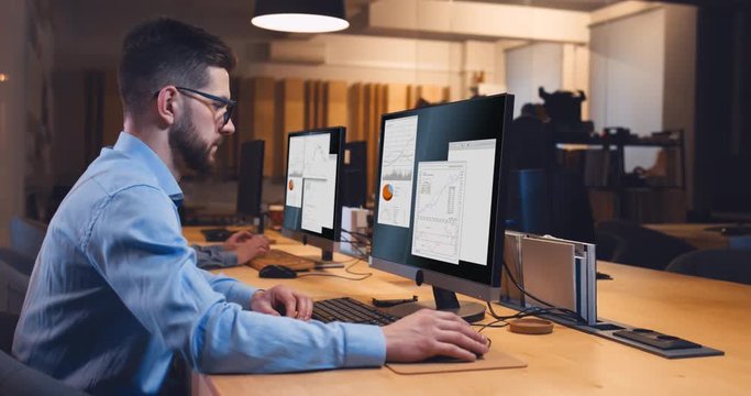 Man and woman colleagues professionals communicating while working together in modern office. Custom screen interface design. 4K UHD