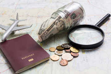 Preparation for travel, money and passport on wooden table,Top view