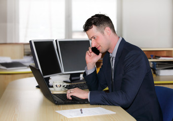  A young  manager working on a computer 