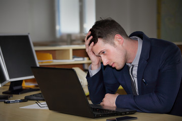 A young  manager working on a computer 