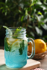 Citrus lemonade water with lemon sliced and mint in blue jar