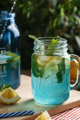 Citrus lemonade water with lemon sliced and mint in blue jar
