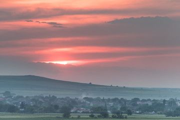 Obraz premium Beautiful rural landscape with a big setting sun, Dobrogea, Romania