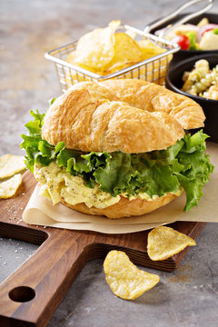 Egg salad sandwich on croissant
